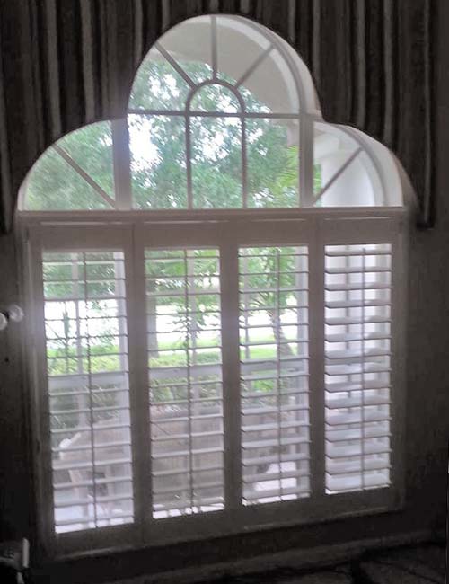 plantation window shutters - wood shutters painted white with adjustable slats