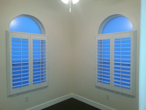 plantation window shutters - work nicely under arched windows