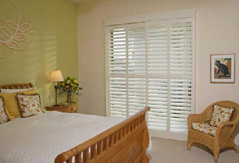 plantation window shutters - work nicely under arched windows