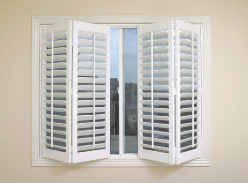 plantation window shutters - wood shutters painted white with adjustable slats
